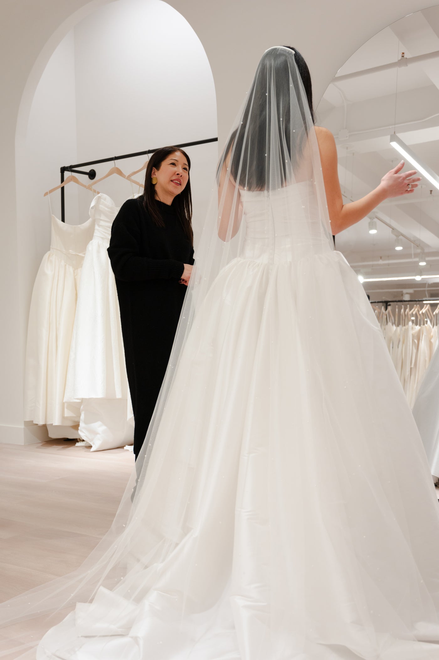 Bride in Dress at Shop with Consultant